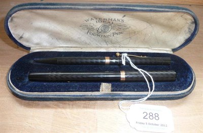 Lot 288 - A Cased Waterman's Ideal Pen Set, comprising fountain pen and propelling pencil in black engine...