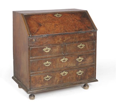 Lot 1399 - A Yewwood Bureau, the burr yew quarter-veneered fall enclosing a fitted interior of pigeons above a