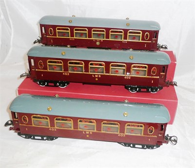 Lot 34 - Three Hornby 'O' Gauge No.2 Bogie Saloon Coaches, all numbered 402, in LMS maroon livery, each with