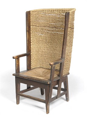 Lot 1406 - A Late 19th Century Stained Pine Orkney Chair, the curved woven rush back between two upright...