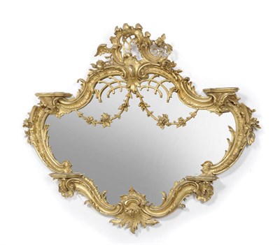 Lot 1410 - A Rococo Style Gilt and Gesso Wall Mirror, late 19th century, the cartouche shaped mirror within an