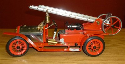 Lot 84 - A Mamod Live Steam Fire Engine, in red with aluminium extending ladder, instructions and...