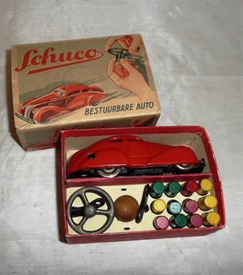 Lot 89 - A Boxed Schuco 'Bestuurbare Auto 3000' Tele-Steering Car, with steering wheel, wires, markers,...