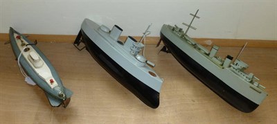 Lot 92 - Two Sutcliffe Clockwork Tinplate Battleships - Valiant and Grenville, both with black hulls,...