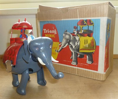 Lot 100 - Three Boxed Clockwork Toys:- Tri-ang Minic Elephant & Howdah, in grey and red plastic,...