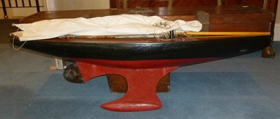 Lot 121 - A Large Early 20th Century Wooden Pond Yacht 'Britannia', with red painted hull and keel, black...