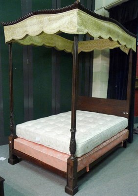 Lot 1414 - A Mahogany Four Poster Bed, with green and silk velvet drapery, the serpentine shaped canopy...