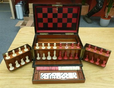 Lot 159 - A 19th Century Coromandel Games Compendium, containing a natural and red stained bone chess...