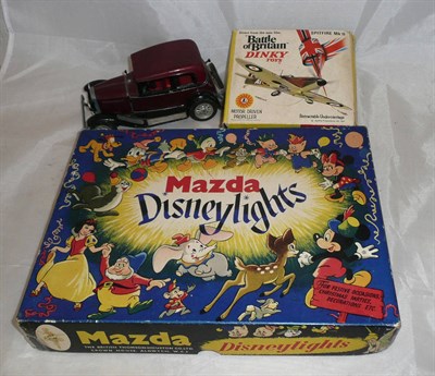 Lot 176 - A Boxed Set of Mazda Disneylights, with instructions; A Boxed Dinky Spitfire Mk II No.719, with...