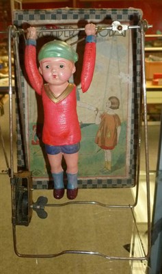 Lot 182 - A Boxed Japanese Clockwork Celluloid Wonder Acrobat, the child acrobat on wire frame with...