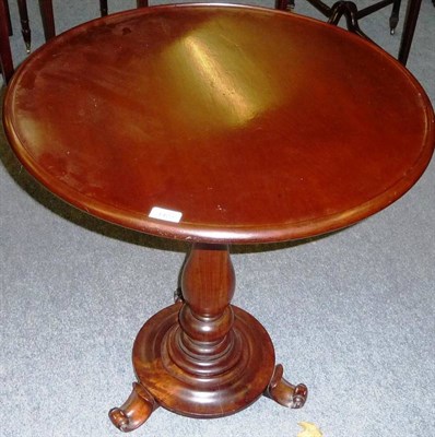 Lot 1423 - An Early Victorian Mahogany Pedestal Table, the circular dished top on a ring turned baluster...