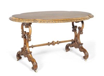 Lot 1428 - A Victorian Walnut and Floral Marquetry Centre Table, circa 1870, the oval shaped top with...