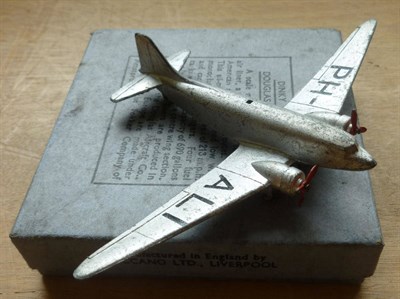 Lot 264 - A Boxed Dinky Douglas D.C.3 Airliner No.60t, in silver with PH-ALI markings, two red...