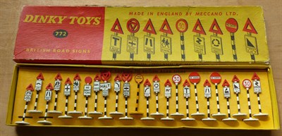 Lot 271 - A Boxed Set of Dinky British Road Signs No.772, containing twenty four signs, in yellow and red...