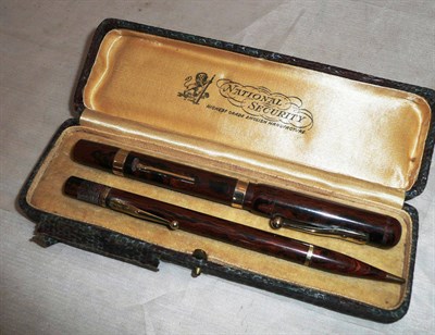 Lot 291 - A National Security Fountain Pen & Propelling Pencil Set,  in mottled brown, the pen with two...