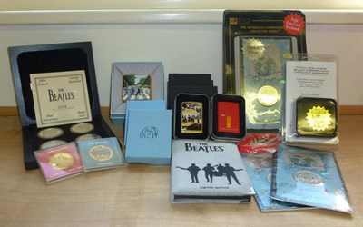 Lot 302 - A Collection of John Lennon and The Beatles Commemorative Coins, includes gold, silver and base...