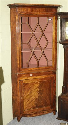 Lot 1432 - A Late George III Mahogany, Ebony and Boxwood Strung Standing Corner Cabinet, the projecting...