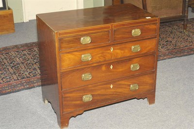 Lot 1433 - A George III Mahogany Chest of Drawers, circa 1800, the rectangular top with ebony and boxwood...