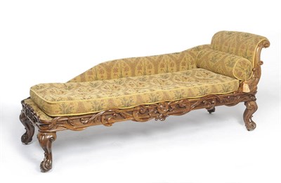 Lot 1434 - A William IV Rosewood Chaise Longue, upholstered in brown floral printed velvet, the scrolling leaf