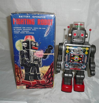 Lot 61 - A Boxed Japanese Tinplate Battery Operated Fighting Robot by Horikawa, in grey and red, with...