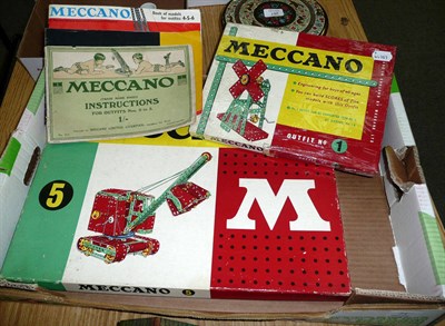 Lot 71 - A Boxed Meccano Outfit No.5, containing red and green pieces and blue wheels, together with an...