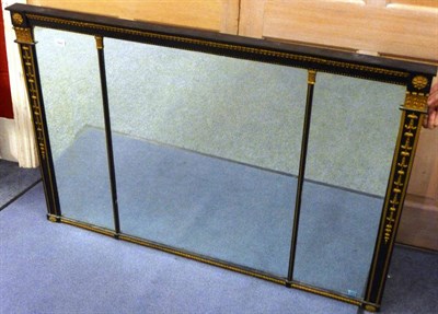 Lot 1443 - A Regency Ebonised and Parcel Gilt Overmantel Mirror, of rectangular form, the stiff leaf and...