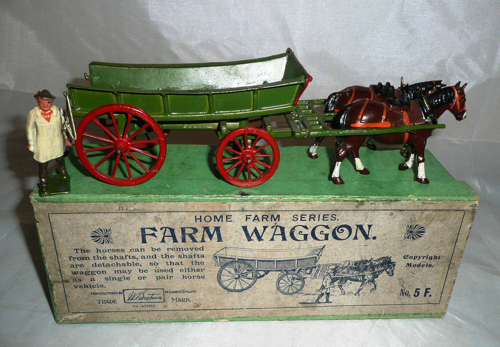 Lot 79 - A Boxed Britains 'Home Farm Series' Lead Farm Waggon No.5F, with two brown horses, a green...