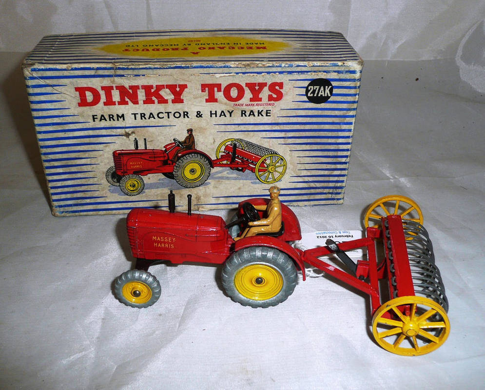 Lot 238 - A Boxed Dinky Farm Tractor & Hay Rake No.27AK, in red, with yellow hubs and tan driver, blue...
