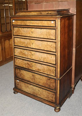 Lot 1459 - A Late 19th Century French Walnut and Ebonised Samainier, the bold cornice above seven long drawers