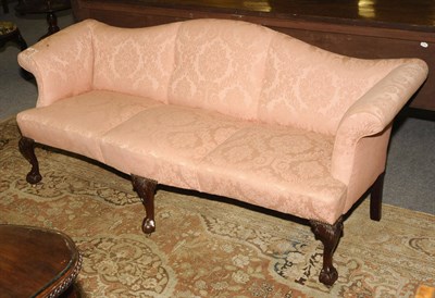 Lot 1468 - A George III Style Mahogany Framed Three-Seater Settee, covered in salmon pink cloth, the...