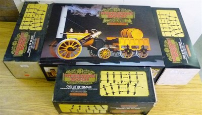Lot 1 - A Boxed Hornby 3 1/2-Inch Gauge 'Stephenson's Rocket' Live Steam Train Set, together with three...