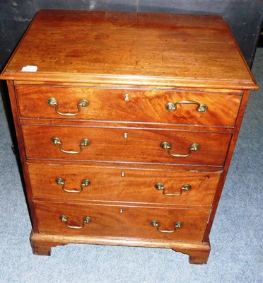 Lot 1473 - A George III Mahogany Chest Commode, the hinged lid with two sham drawers opening to reveal a...