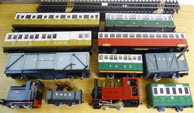 Lot 49 - A PNGR 'O' Gauge Live Steam Garden Railway Set, comprising an 0-4-0 locomotive in maroon livery, an