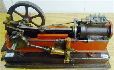 Lot 84 - A Large Single Cylinder Horizontal Stationary Engine, painted red, with gas attachment, spoked...