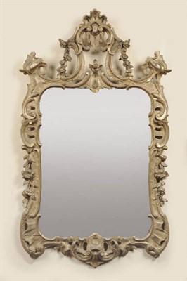 Lot 1478 - A Gilt Composition Mirror in the Rococo Style, the shaped rectangular plate with an elaborate...