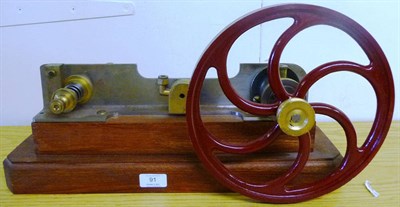 Lot 91 - A Large Single Cylinder Mill Engine, in brass and steel, with maroon painted spoked flywheel,...
