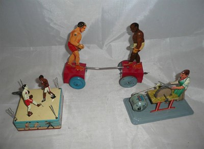 Lot 100 - Three Lithographed Clockwork Tinplate Toys, comprising an Arnold Scissor Grinder and two...