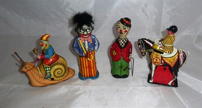 Lot 103 - Four Novelty Clockwork Tinplate Toys:- Fairylight Charlie Chaplin, with twirling cane; English...