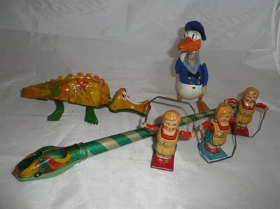 Lot 104 - Six Tinplate Toys, comprising a Triang Minic clockwork 'Jabberwock', Schuco Donald Duck...