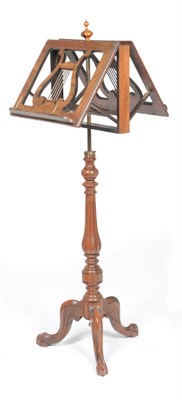 Lot 1480 - A Victorian Rosewood Duet Stand, the pivoting lyre shaped music stands raised on an adjustable...