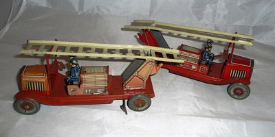 Lot 109 - Two English Clockwork Tinplate Fire Engines, each with Dunlop 90 tyres and two blue uniformed...