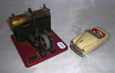 Lot 112 - A Schuco Clockwork Tinplate Tacho-Examico 4002 Car, in cream with red interior; An S.E.L Model 1550