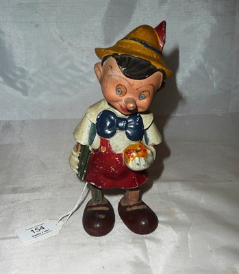 Lot 154 - A Clockwork Composition Walking Pinocchio Toy, with moving head and legs, 20cm tall (damage to...