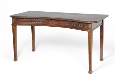 Lot 1486 - An Adams Revival Mahogany Concave Serving Table, circa 1900, the shaped top with a moulded and...