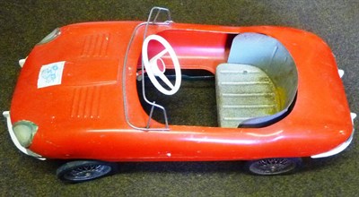 Lot 176 - A Tri-ang Tinplate E-Type Jaguar Pedal Car, with red painted body, white plastic steering...