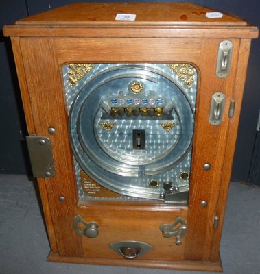 Lot 188 - An Oak Cased Wall Mounted Allwin Type Flick a Ball Coin Operated Amusement Machine, the brushed...