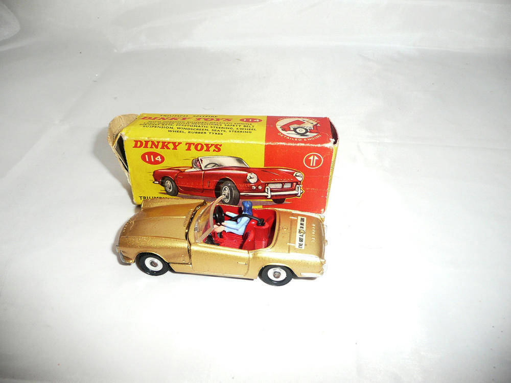 Lot 237 - A Boxed Dinky Triumph Spitfire No.114, with gold body, 'Tiger in Tank' decals, red interior,...