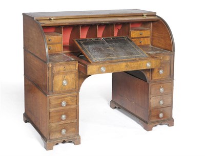 Lot 1493 - A Late George III Mahogany Cylinder Desk, the upper section with a fitted interior of pigeon...