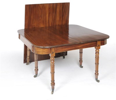 Lot 1498 - A Late George III Mahogany Extending Dining Table, the rounded rectangular top with reeded...