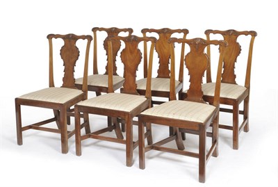 Lot 1500 - A Set of Six George III Mahogany Dining Chairs, the wavy shaped top rails with carved anthemion and